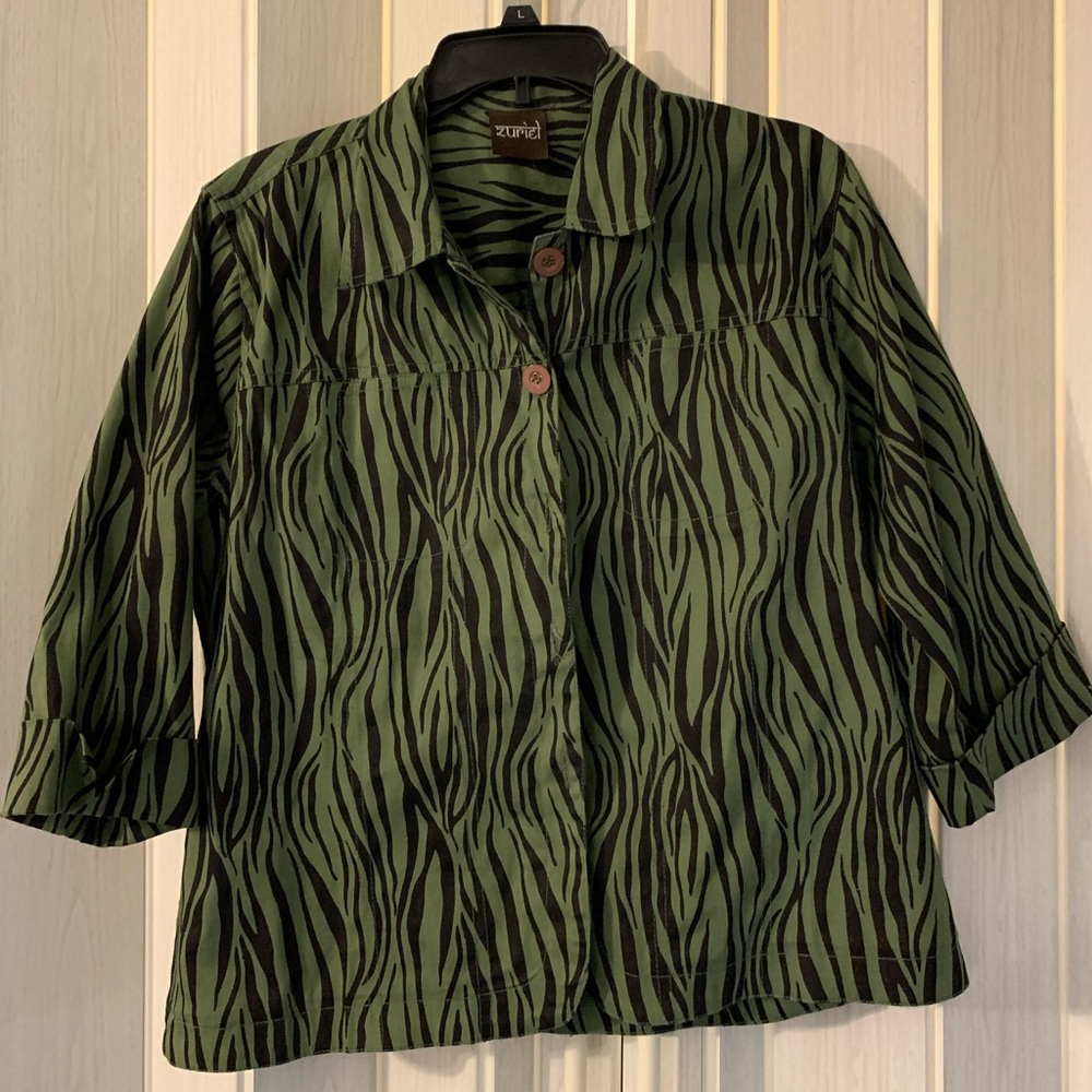 Green and black zebra print top.